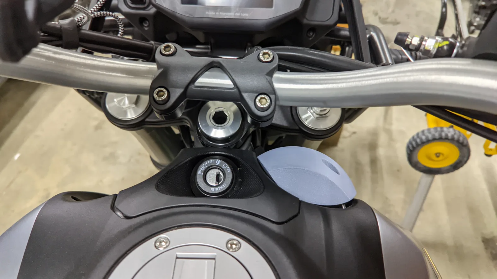 The first 3D-printed wind deflector prototype mounted beside the steering head