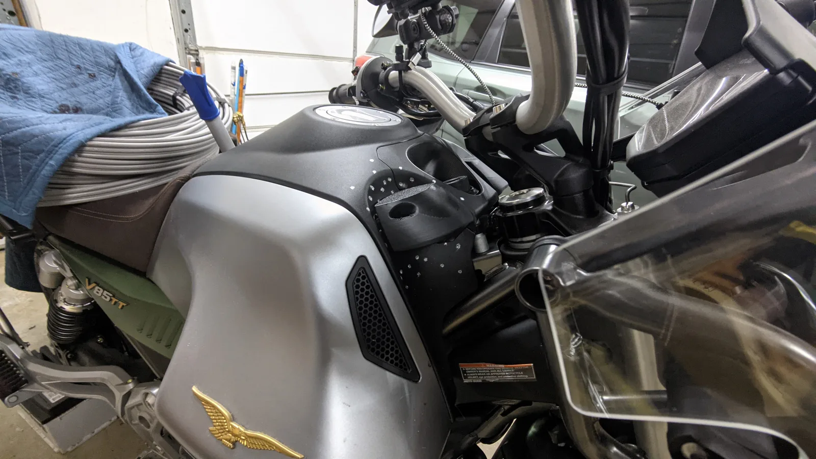 A black deflector prototype covered in photogrammetry reference markers