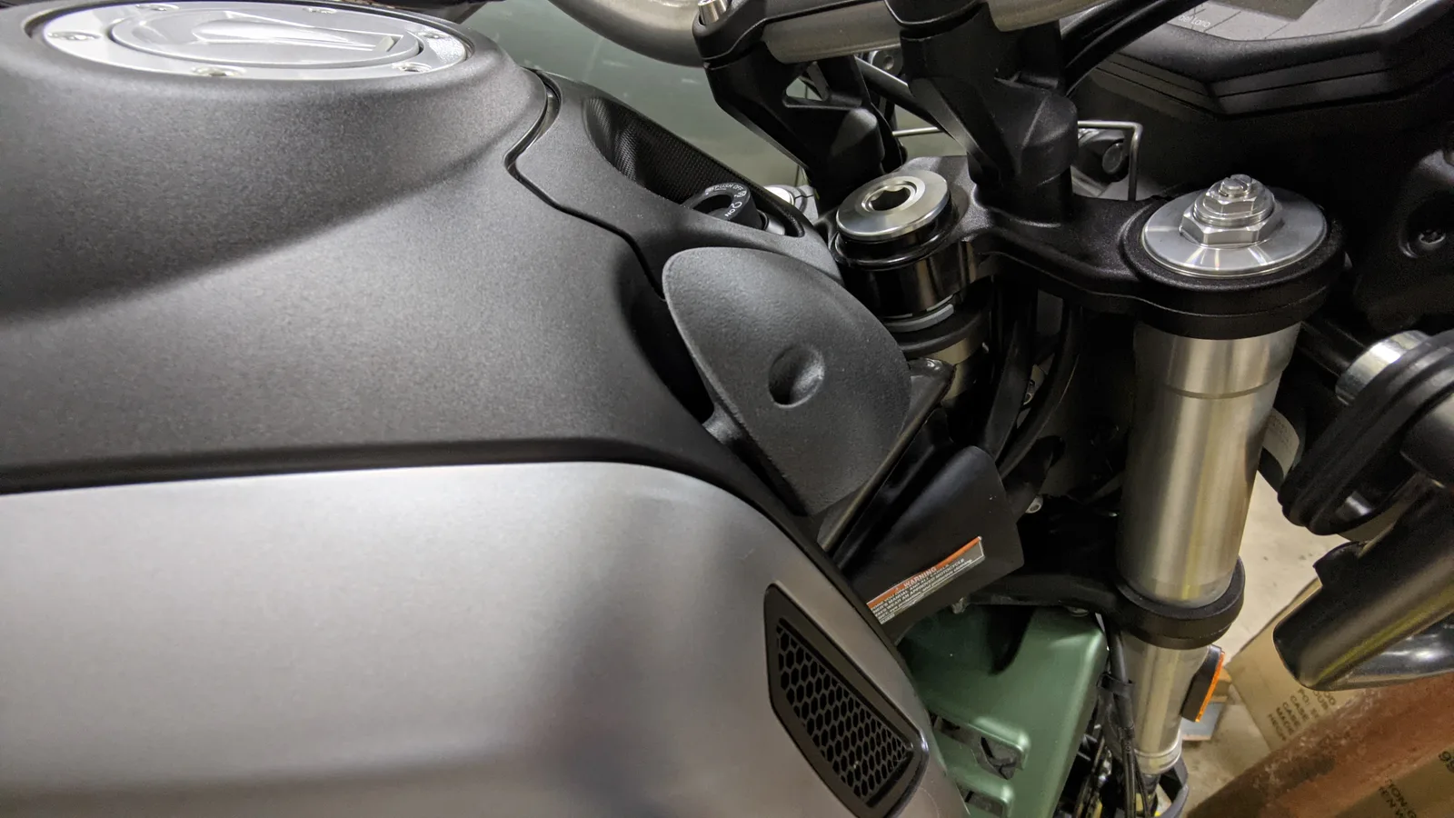 The finished matte black wind deflector installed on the V85 TT
