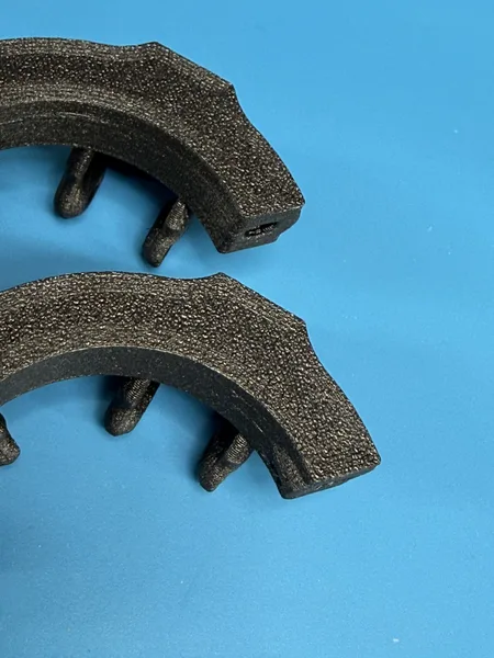 Two StickFree Yoke Fix halves side by side, showing the difference at the clamp end